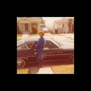 Old Vintage Photo BLACK AFRICAN WOMAN IN BLUE DRESS WITH CLASSIC CAR 1979 - Picture 1 of 2