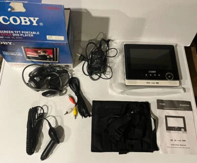 PARTS OR REPAIR Coby TF-DVD7105 - 7in Widescreen Portable DVD Player With Cords - Image 1 of 3