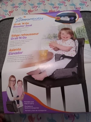 Asiento elevador portátil de viaje Dreambaby Grab 'n Go. Compartimento de almacenamiento.  Nuevo. Foto 1 de 4