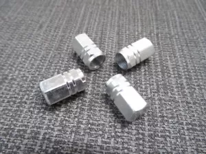 JAGUAR SILVER ALUMINIUM METAL SOLID TYRE/WHEEL HEXAGON DUST VALVE CAPS x4 - Picture 1 of 12