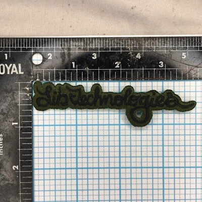 VINTAGE LIB TECH SNOWBOARDS ADVERTISING GREEN BLACK 3.75" IRON ON CLOTH PATCH - Image 1 of 2
