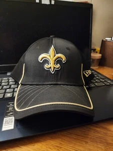 NEW ORLEANS SAINTS Ball Cap NEW ERA 39 THIRTY Black W/Gold Logo L/XL Hat NFL - Picture 1 of 4