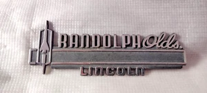 RANDOLPH OLDS. LINCOLN- METAL CAR DEALERSHIP EMBLEM - VINTAGE - Picture 1 of 2