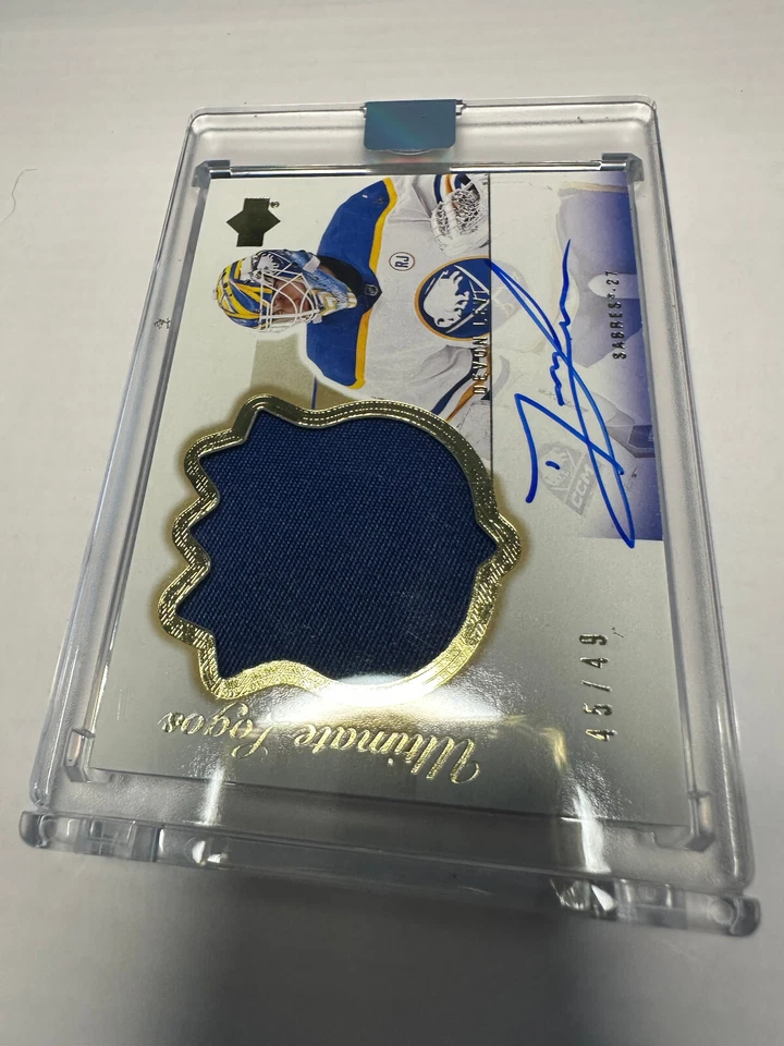 23-24 Ultimate Collection Devon Levi GOLD Ultimate Logos Rookie Auto /49 03R-DL - Image 1 of 2