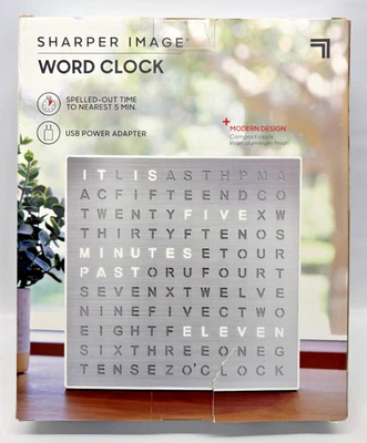 SHARPER IMAGE LIGHT UP ELECTRONIC WORD CLOCK, SILVER LED DISPLAY - Image 1 of 4