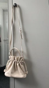 Beige colour pouch shape small shoulder bag - Picture 1 of 9