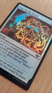 Take Up the Shield 0034 OTJ Foil Magic the Gathering Karte - Bild 1 von 3