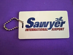 SAWYER International Airport Passagiergepäck Namensschild, Original - Bild 1 von 2