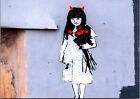 Banksy Art Girl With Red Horns and Red Tulips Near The Love Cheat Bristol BS.29