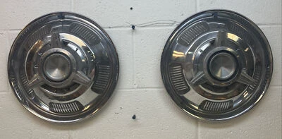Juego de 2 tapacubos giratorios de 14" Mercury Comet 1966-1967 (5227) usados OEM Foto 1 de 4