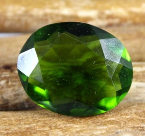 AGI-zertifizierter brasilianischer olivgrüner Peridot 55,95 ct/30 mm ovaler Edelstein T8871 - Bild 1 von 7