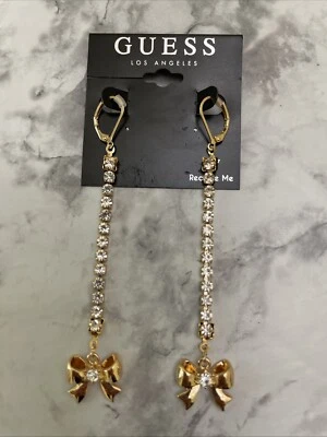 Pendientes colgantes Guess tono dorado arco lineal y cristal pavé cadena detallada Foto 1 de 4