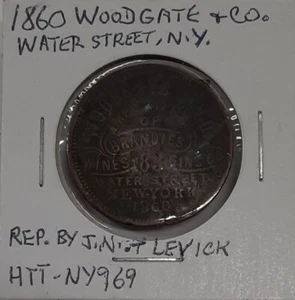1860 Ad Token Woodgate & Co, Water St. NYC Importador de Licores Usado con Picaduras - Imagen 1 de 3