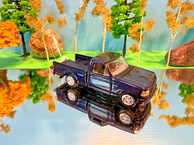 Johnny Lightning 1/64 ERTL TOMY Diecast azul oscuro 1993 Ford SVT F-150 Lightning Foto 1 de 3