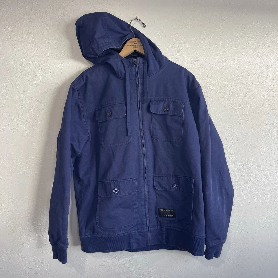 Chaqueta Oakley Utility con Capucha L Azul Cremallera L Lona Acolchada Forrada Ropa de Calle Foto 1 de 4