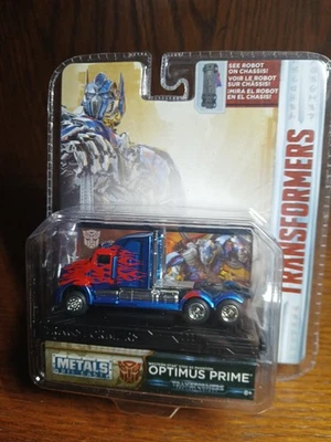 Camión semi plataforma Transformers Optimus Prime Western Star 5700 XE Phantom 1/64 Jada Foto 1 de 4