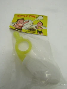 NIB OLD DIME STORE TOY PRIZE YELLOW SQUIRT RING TOY PRIZE HONG KONG - Picture 1 of 2