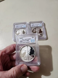 1986 1987 1988 AMERICAN SILVER EAGLE-PERFECT ICG PF70 DCAM- SIGNED AUSTIN HUTTON - Picture 1 of 3