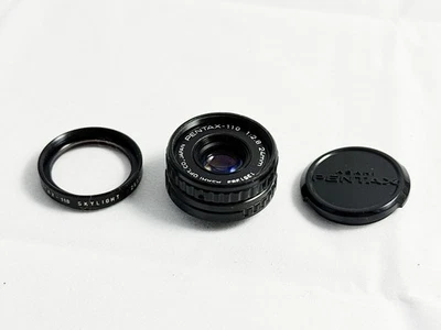 Pentax 110 Lens- 24mm F2.8 With Skylight Filter & Cap. Clear Optics - Image 1 of 4