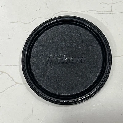 Nikon Original Plastic Lens Cap. 85 mm. Can Be Fit On 82 mm Filter Size Lens. - Image 1 of 3