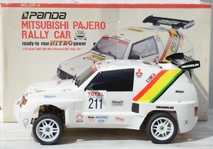 PANDA MITSUBISHI PAJERO RALLY 4WD VOITURE NITRO BRÛLEUR 1/10 VINTAGE - Photo 1/17