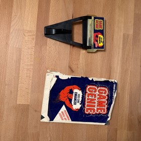 Nintendo NES Game Genie with Original Booklet Missing Back Cover