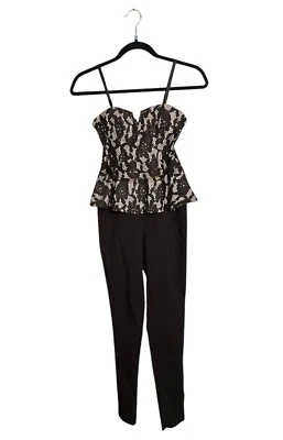 Mono Material Niña Negro Con Cintura Peplum Talla XSMALL  Foto 1 de 4