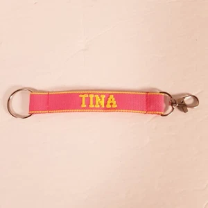TINA Embroidered Name Strap Key Ring Keychain with Clasp Pink & Yellow - Picture 1 of 9