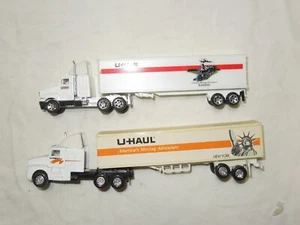 1:64 Two U Haul Semi tractor trailers by Road Champs and Maisto - Picture 1 of 4