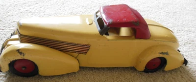 VINTAGE WYANDOTTE PRESSED STEEL CORD Pull Back CAR  Cream Red Coffin Nose - Image 1 of 4