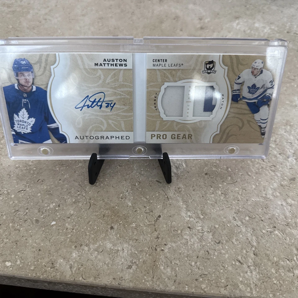 2018-19 UD The Cup Hockey Auston Matthews pro Gear Patch Auto Booklet /12 - Image 1 of 2