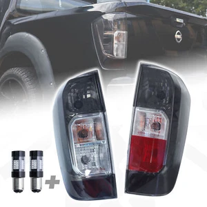 Luces traseras ahumadas para Nissan Navara NP300 D23 2016+ (especificaciones del Reino Unido) lámpara tintada + bombillas - Imagen 1 de 10