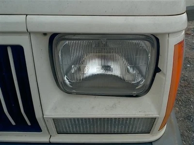 Driver Left Headlight Fits 84-96 Jeep Cherokee OEM - Image 1 of 4