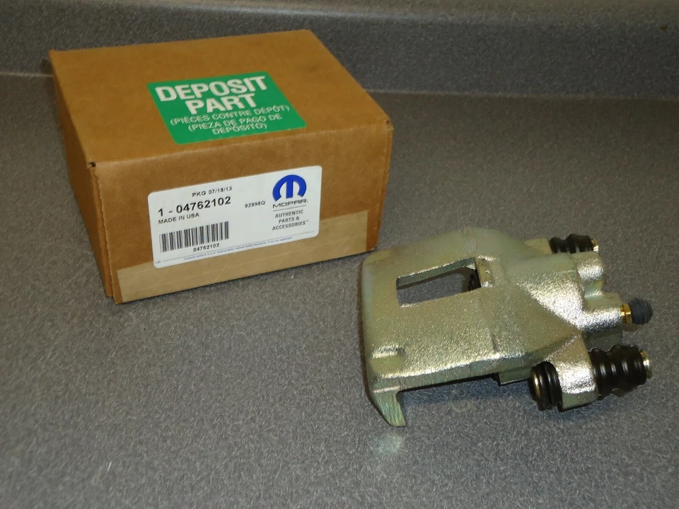 Pinza de freno trasera derecha nueva OEM Mopar 4762102 1994-1998 Jeep Grand Cherokee Foto 1 de 4