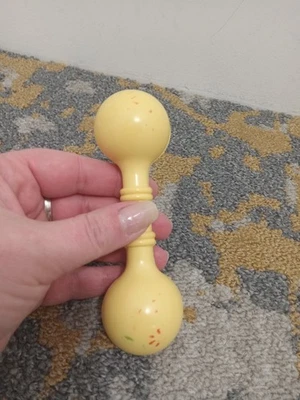 Vintage 1960s Hard Plastic Celluloid Plakie Barbell Baby Rattle Yellow - Image 1 of 4