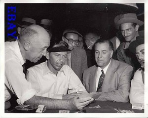 Director Otto Preminger shows Frank Sinatra cards    Photo From Original Negatve