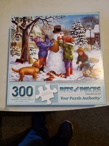 Jigsaw Puzzle - "Building A Snow Man On A Snow Day" by Bits & Pieces 300 Pieces - Picture 1 of 2