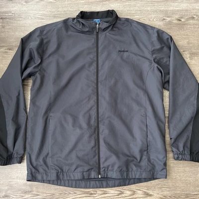 Chaqueta cortavientos Reebok vintage forrada de malla para hombre gris medio Foto 1 de 4