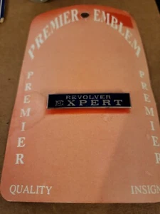 REVÓLVER VINTAGE TONO PLATA EXPERTO ESMALTE AZUL PIN OJO DE BUEY FRANCOTIRADOR NOS - Imagen 1 de 2