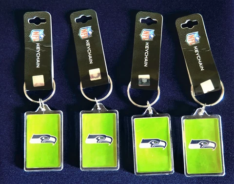 FOUR (4) SEATTLE SEAHAWKS ACRYLIC KEY RINGS FROM PRO SPECIALTIES Cover