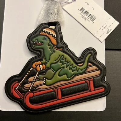 Nuevo con etiquetas Bolso Trineo Navidad Coach Rexy Etiqueta Verde y Rojo T-Rex Dinosaurio 🦖 NUEVO Foto 1 de 4