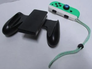 Official Nintendo Switch black grip, strap, right green joy con controller - Imagen 1 de 3