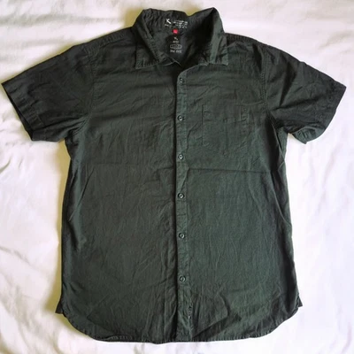 ...Camisa de algodón con botones de manga corta verde LG Lost Enterprises para hombre con bolsillo Foto 1 de 4