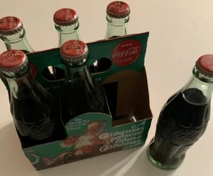 6 Coca Cola Gedenkflaschen "Ein Weihnachtsgeschenk aus vergangener Weihnacht" - Bild 1 von 2