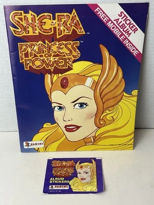 💥1986 Álbum de pegatinas Panini She-Ra Princesa del Poder + Paquete ¡Envío de 1 día sin usar!👍 Foto 1 de 4