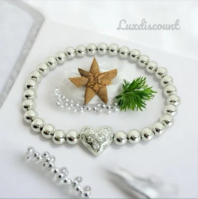 Pulsera elástica Kendra Scott corazones holandeses rodio en tono plata. Foto 1 de 4