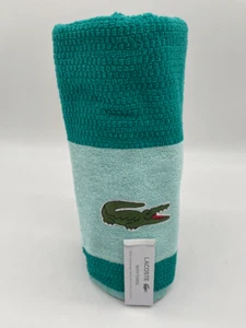 Asciugamano da spiaggia Lacoste 100% cotone passanti taglia 30 x 52 verde acqua nuovo con etichette - Foto 1 di 5