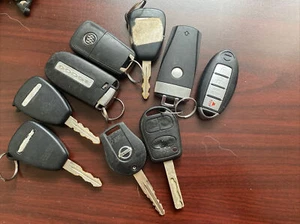 Lot of 9 assorted Jeep Ram Nissan Land Rover Smart key fobs Used - Picture 1 of 2