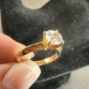 Faux Engagement Gold Tone Ring With Simulated Solitaire Diamond. - Picture 1 of 9