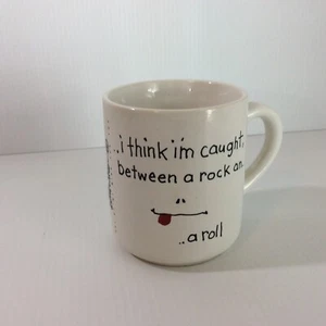 I Think I'm Caught Between a Rock and a Roll Neuheit Kaffeebecher Out of My Mind - Bild 1 von 12